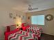 Comfortable bedroom showcasing two beds, ceiling fan, and providing a relaxing space at 2022 Big Bend Way, Henderson, NV 89074