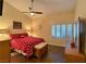 Cozy bedroom with vaulted ceiling, ceiling fan, and plantation shutters at 2022 Big Bend Way, Henderson, NV 89074