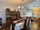 Open dining room showing table with 6 seats that flows into the living room at 2022 Big Bend Way, Henderson, NV 89074