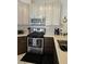 Cozy kitchen with modern appliances, beautiful cabinets, and a view of breakfast nook at 2022 Big Bend Way, Henderson, NV 89074