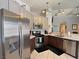 Kitchen showcasing stainless steel appliances, two-tone cabinets, and sleek countertops at 2022 Big Bend Way, Henderson, NV 89074