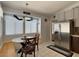 Bright eat-in kitchen featuring stainless steel appliances, tile floors, and a cozy dining area at 2022 Big Bend Way, Henderson, NV 89074