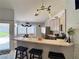 Kitchen with bar stool seating at the peninsula and views into the breakfast nook at 2022 Big Bend Way, Henderson, NV 89074