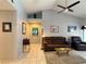 Bright living room with vaulted ceiling, ceiling fan, neutral decor, and comfortable furnishings at 2022 Big Bend Way, Henderson, NV 89074
