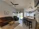 Spacious living area with vaulted ceiling, bar, fireplace and sliding glass door to backyard at 2022 Big Bend Way, Henderson, NV 89074