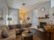 Inviting living room with sectional sofa, fireplace, piano and vaulted ceilings at 2022 Big Bend Way, Henderson, NV 89074