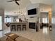 Open-concept living space featuring breakfast bar, fireplace, and tile flooring at 2022 Big Bend Way, Henderson, NV 89074