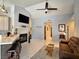 Inviting living room with vaulted ceilings, tiled fireplace, ceiling fan, and neutral decor at 2022 Big Bend Way, Henderson, NV 89074