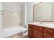 Full bathroom features tile floors, shower over tub, single sink and vanity at 2489 Black River Falls Dr, Henderson, NV 89044
