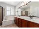 Bathroom features double sinks, walk-in shower, and separate soaking tub at 2489 Black River Falls Dr, Henderson, NV 89044
