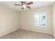 Bedroom with carpet, ceiling fan and a bright window at 2489 Black River Falls Dr, Henderson, NV 89044