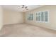 Large primary bedroom with ceiling fan and ample natural light from bright windows at 2489 Black River Falls Dr, Henderson, NV 89044