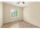 Bedroom featuring tile flooring, and a window with bright white shutters at 2489 Black River Falls Dr, Henderson, NV 89044