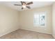 Bedroom featuring carpet flooring, neutral walls, ceiling fan, and a window with shutters at 2489 Black River Falls Dr, Henderson, NV 89044