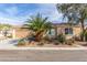 Inviting single-story home with desert landscaping, covered entry and attached two-car garage at 2489 Black River Falls Dr, Henderson, NV 89044