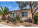 Inviting single-story home with desert landscaping, covered entry and attached two-car garage at 2489 Black River Falls Dr, Henderson, NV 89044