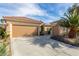 A charming home with a three-car garage and well-manicured landscaping at 2489 Black River Falls Dr, Henderson, NV 89044