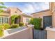 Charming front entrance features lovely landscaping and a gated courtyard at 2489 Black River Falls Dr, Henderson, NV 89044