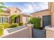 Beautiful home exterior with lush front yard, mature landscaping, and covered entryway at 2489 Black River Falls Dr, Henderson, NV 89044