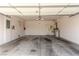 Spacious three car garage with a utility corner and lots of room for vehicles and storage at 2489 Black River Falls Dr, Henderson, NV 89044