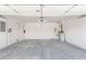 Spacious two-car garage, complete with painted walls, water heater, and concrete floors for easy maintenance at 2489 Black River Falls Dr, Henderson, NV 89044