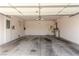 Empty two car garage with water heater and electric panel at 2489 Black River Falls Dr, Henderson, NV 89044