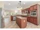 Well-equipped kitchen featuring granite countertops, stainless steel appliances, and a functional island at 2489 Black River Falls Dr, Henderson, NV 89044