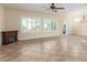 Spacious living room with fireplace, tile floors, and plantation shutters at 2489 Black River Falls Dr, Henderson, NV 89044