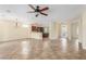 Open-concept living area with tile flooring, recessed lighting, and seamless flow to the kitchen at 2489 Black River Falls Dr, Henderson, NV 89044