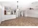 Spacious living area showcasing tile flooring, an open layout, and modern lighting at 2489 Black River Falls Dr, Henderson, NV 89044