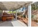 This outdoor patio features a spa under a beautiful pergola with landscaping at 2489 Black River Falls Dr, Henderson, NV 89044