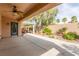 Covered patio with a ceiling fan and view of the landscaped backyard and pergola at 2489 Black River Falls Dr, Henderson, NV 89044