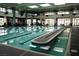 A large indoor pool with clearly marked lanes and abundant natural light from surrounding windows at 2489 Black River Falls Dr, Henderson, NV 89044