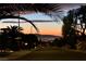 Scenic evening street view showcasing city lights below, with palm trees for a calm, tranquil atmosphere at 2489 Black River Falls Dr, Henderson, NV 89044