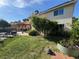 Well-maintained backyard with a patio, pergola, lush green lawn, and garden, creating an inviting outdoor space at 2807 Camelback Ln, Henderson, NV 89074