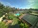 This backyard features a pool, garden, and patio area with mature trees at 2807 Camelback Ln, Henderson, NV 89074