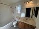Bathroom featuring a single sink, tiled shower and neutral wall colors at 2807 Camelback Ln, Henderson, NV 89074