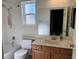 Bathroom featuring a single sink, tiled shower and neutral wall colors at 2807 Camelback Ln, Henderson, NV 89074