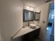 This bathroom features a vanity with mirror and a beige countertop at 2807 Camelback Ln, Henderson, NV 89074