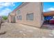 Spacious backyard features gravel landscaping with covered patio at 6536 Castor Tree Way, Las Vegas, NV 89108