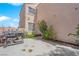 Cozy backyard with concrete flooring, garden and grill with view of the exterior at 6536 Castor Tree Way, Las Vegas, NV 89108