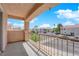 Balcony with a view of the neighborhood, palm trees, and blue skies at 6536 Castor Tree Way, Las Vegas, NV 89108