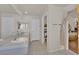 Bathroom area offers a double sink vanity, tile flooring, and ample lighting at 6536 Castor Tree Way, Las Vegas, NV 89108