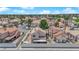Aerial view of a neighborhood with lush landscaping and well-maintained houses at 6536 Castor Tree Way, Las Vegas, NV 89108