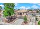 Inviting two-story home with balcony, tile roof, and an attached garage at 6536 Castor Tree Way, Las Vegas, NV 89108
