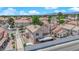 Home exterior with a driveway, small trees, and a small covered patio at 6536 Castor Tree Way, Las Vegas, NV 89108