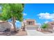 Inviting two-story house with a balcony, two-car garage, and a well-kept front yard at 6536 Castor Tree Way, Las Vegas, NV 89108