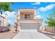 Lovely two-story home showcasing a balcony over a two-car garage with a beautiful tile roof at 6536 Castor Tree Way, Las Vegas, NV 89108