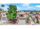 Charming two-story home with a balcony, tile roof, and attached two-car garage at 6536 Castor Tree Way, Las Vegas, NV 89108