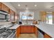 Bright kitchen with wood cabinets, modern appliances and stylish countertops at 6536 Castor Tree Way, Las Vegas, NV 89108